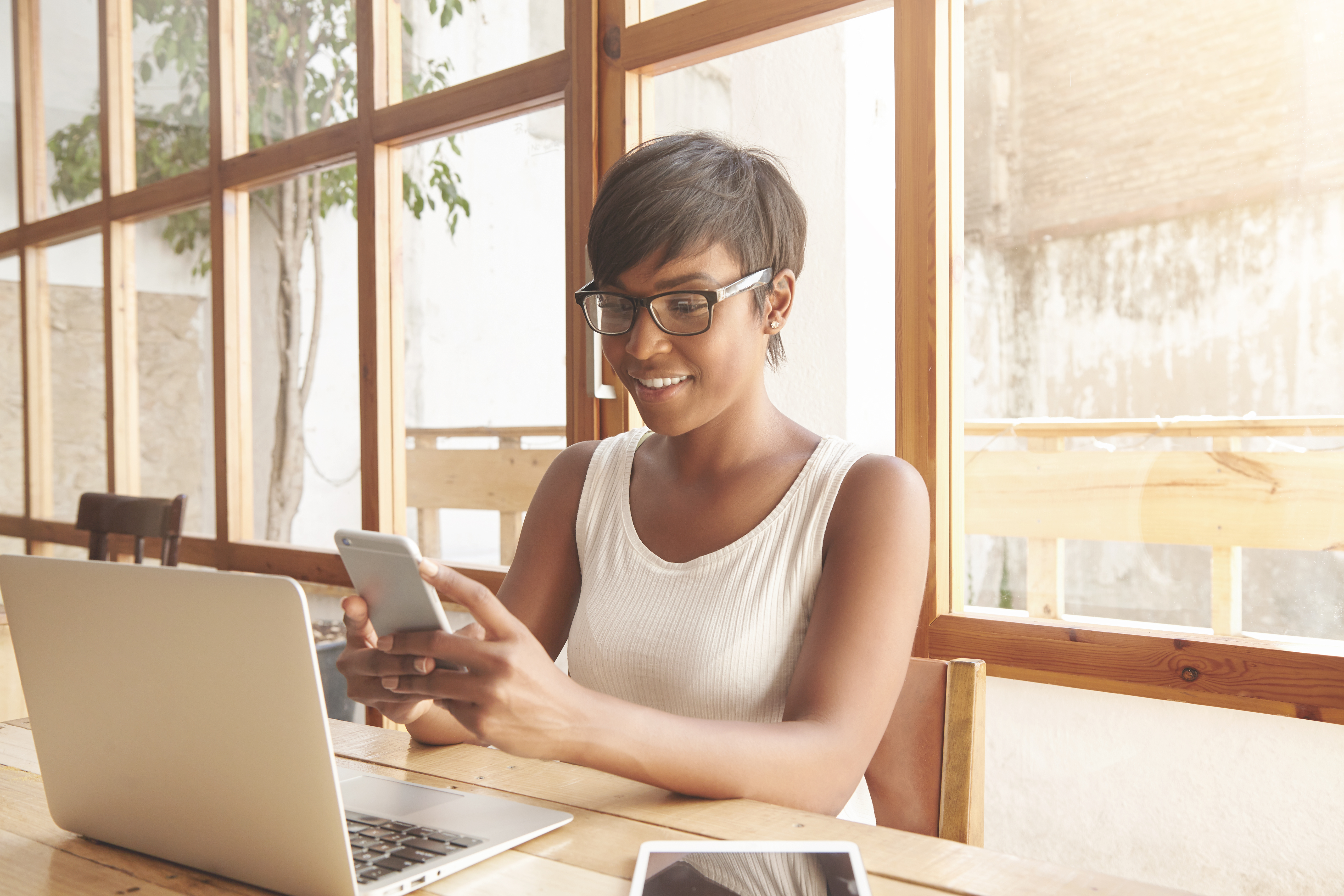 portrait-young-brunette-woman-sitting-cafe-with-laptop